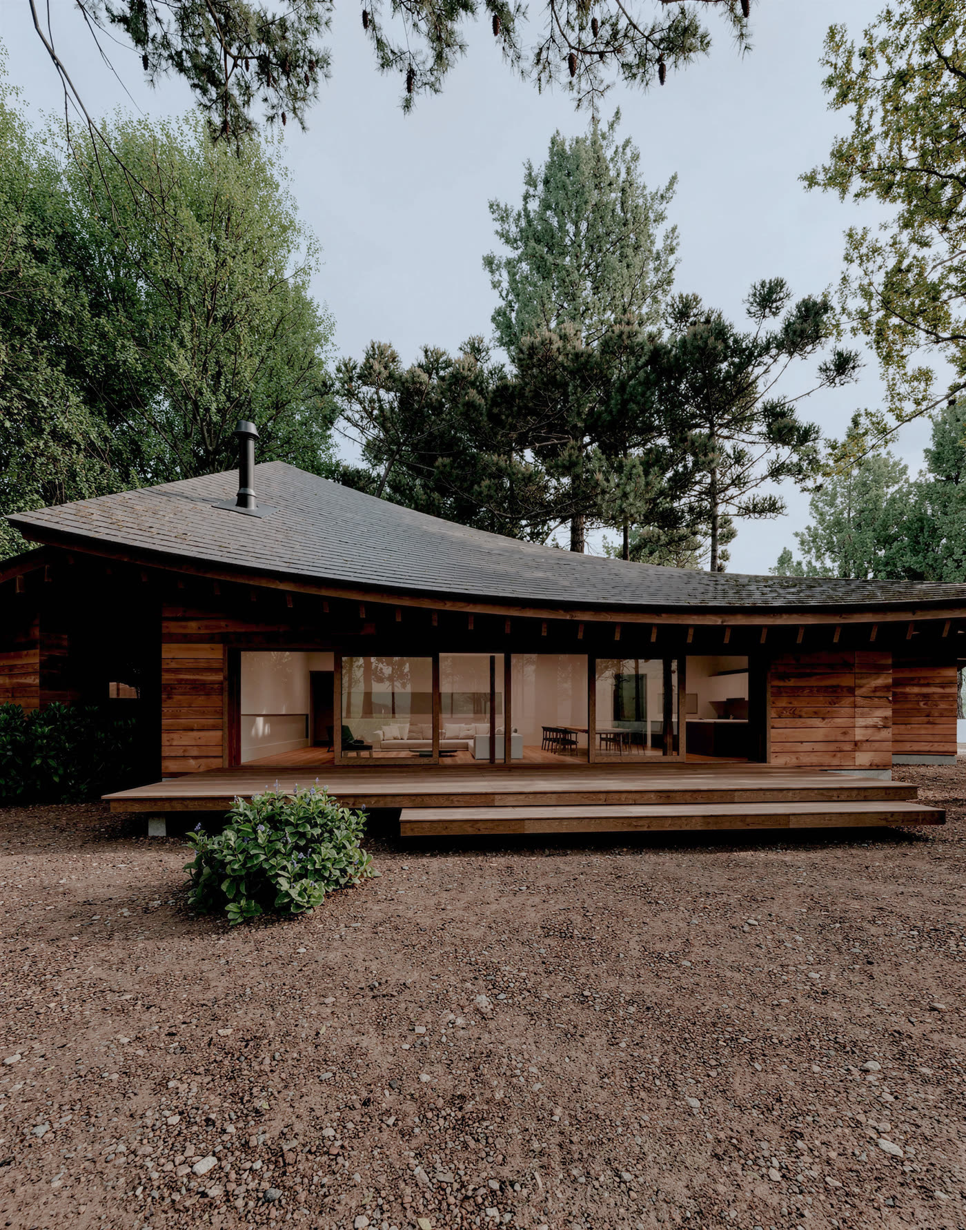 LV House, ön cephe, kavisli çatı ve cam cephe